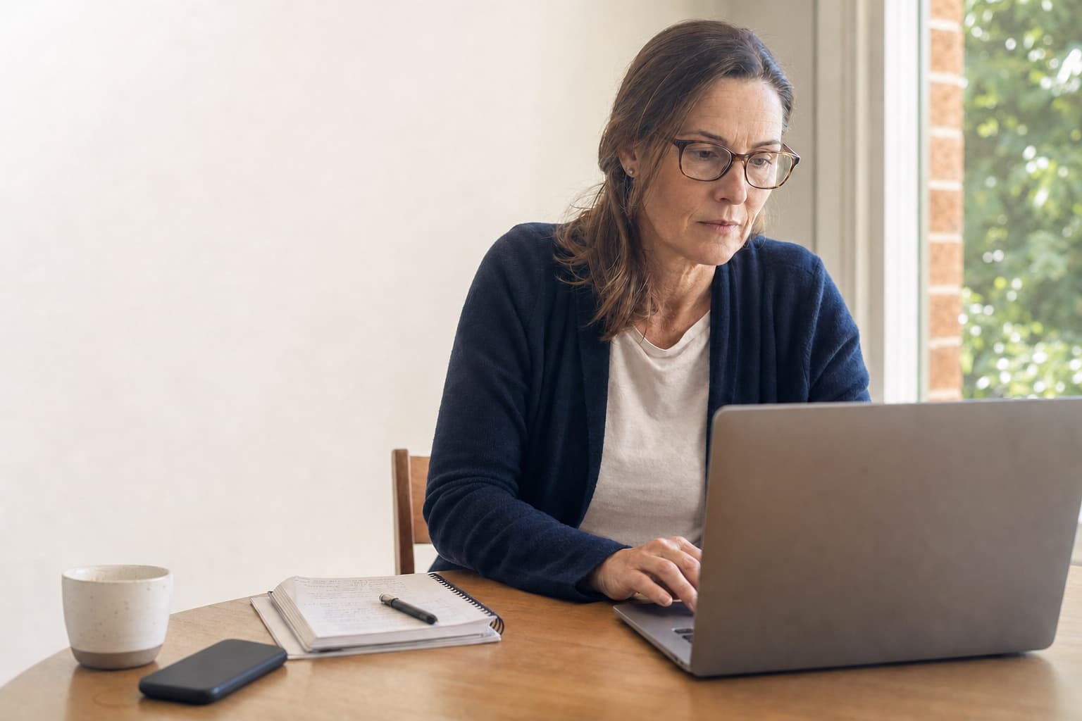 A cautious buyer reading a firm's website closely before deciding to make contact.