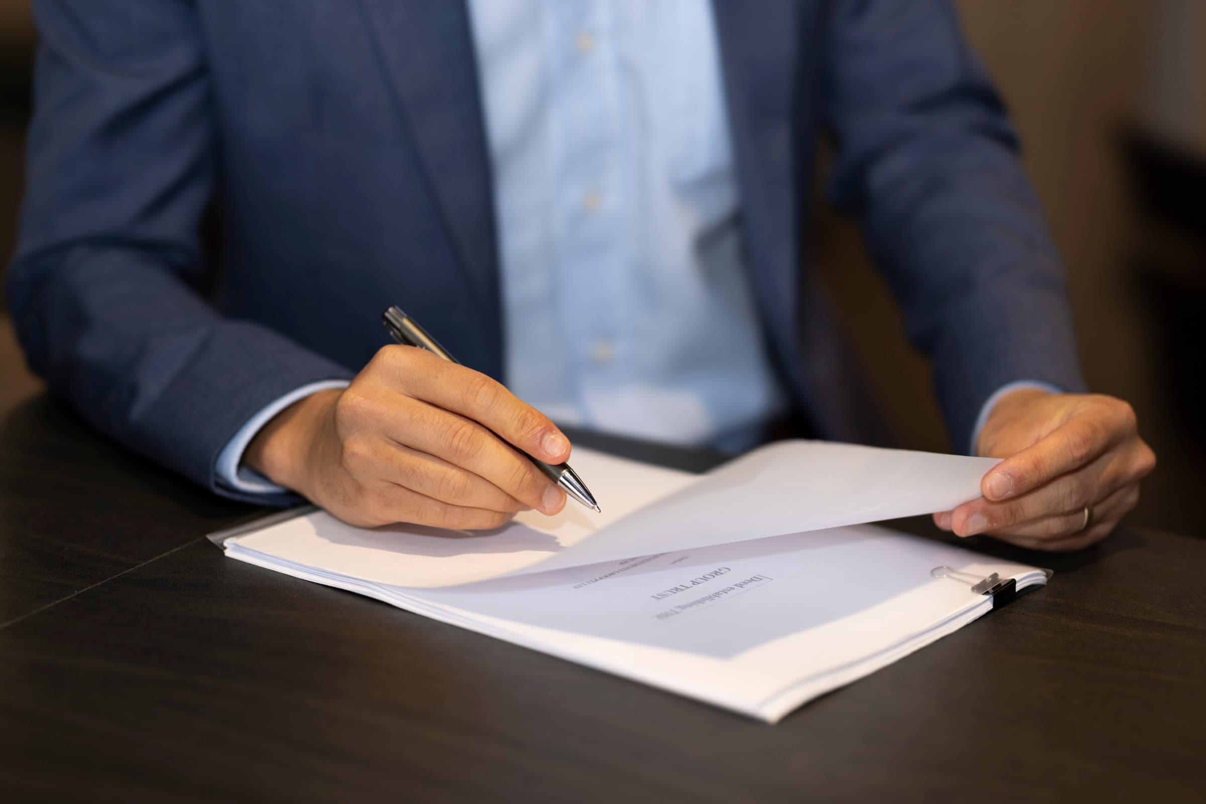 A property contract being signed at Ascension Lawyers