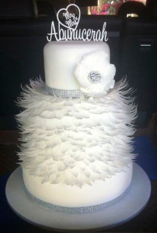 White wedding cake with sugar feather skirt and silver beading